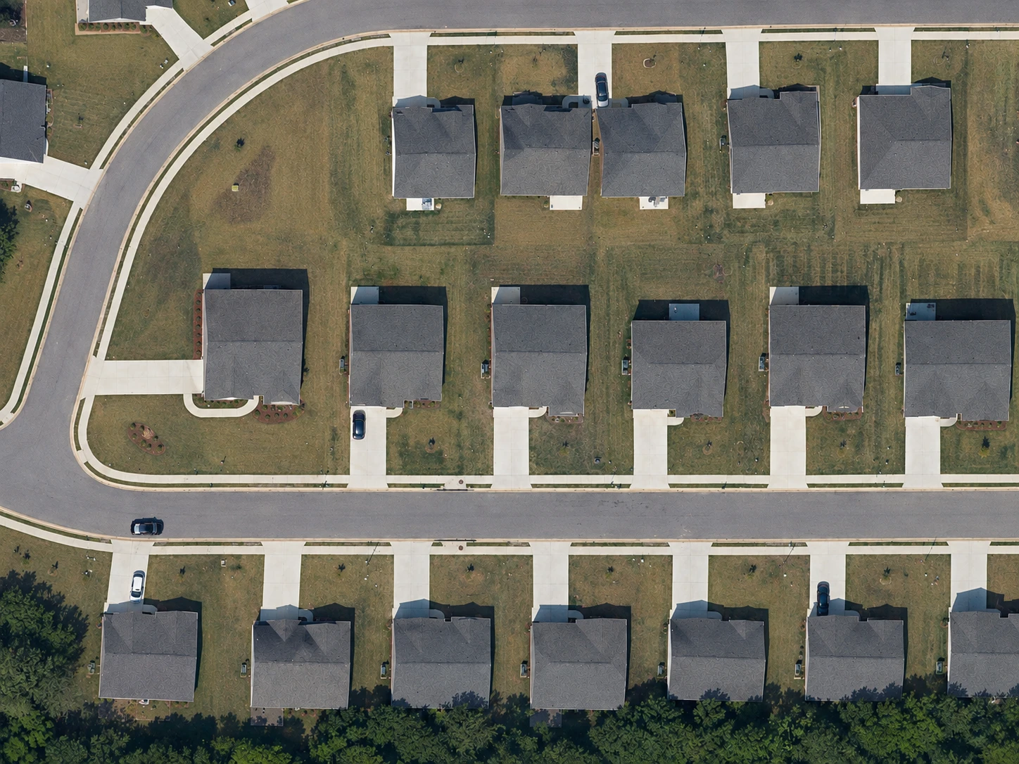 Aerial view of a residential lot with its front lawn traced as a measured area and a Street View camera marker on the road in front of it